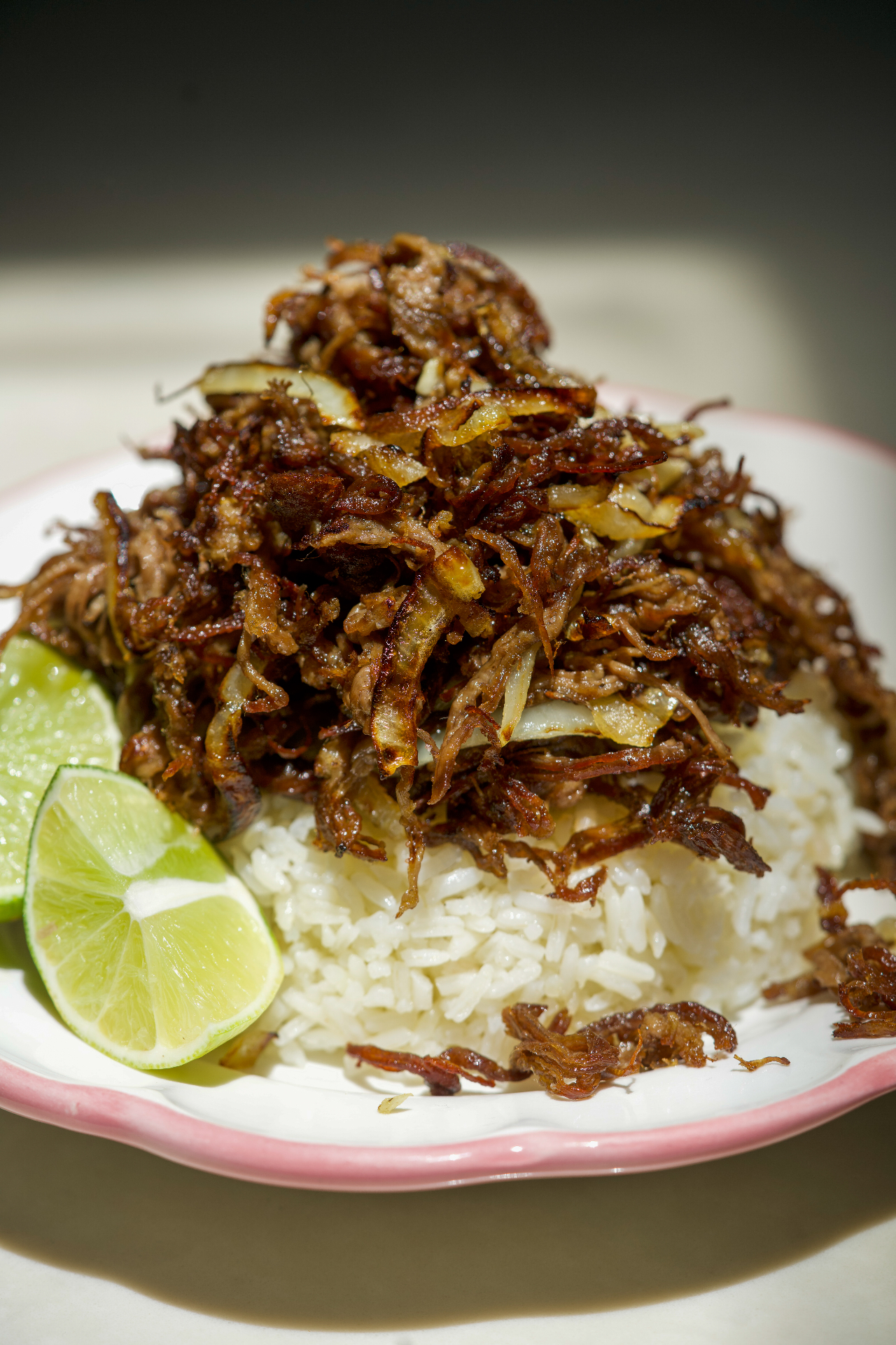 Vaca frita over rice with lime